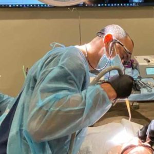 Trainee with Patient During Live Dental Implant Training
